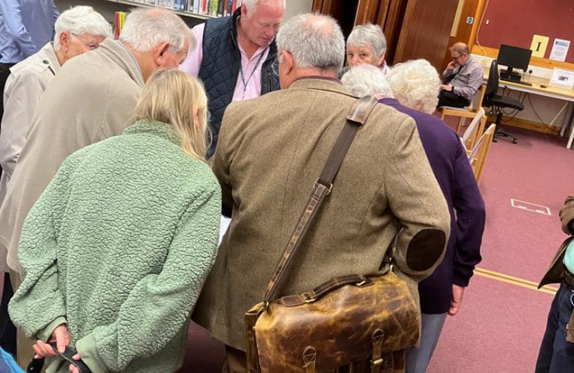 Nic with a group of residents discussing the plan.