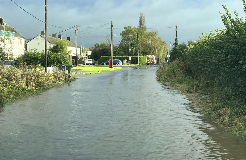 Image of a flooded road taken from a parked car.