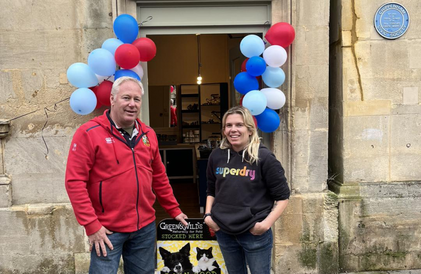 Nic and owner of Pawsome Pet Shop outside the pet shop.