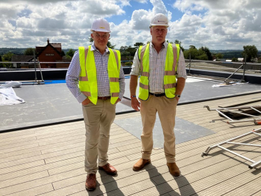 Nic on the auction house roof with Cllr Steve Bucknell.