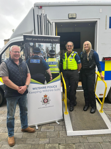 Nic with a Police Officer and PCSO outside the mobile police station.